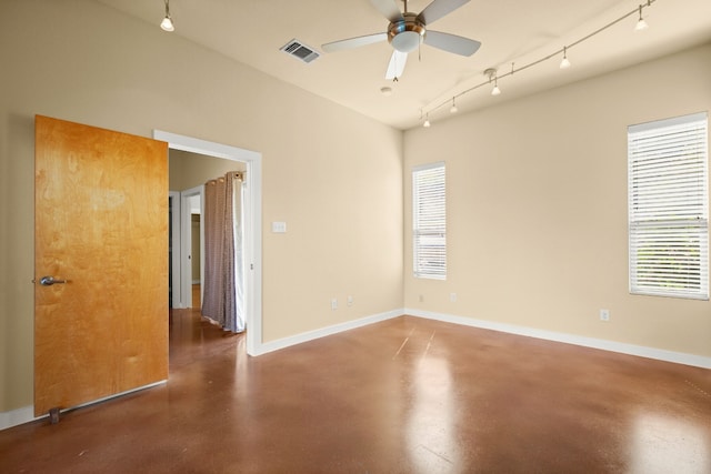 5309 Sendero Hills Pkwy, Austin, TX 78724 - unfurnished room featuring finished concrete flooring, ceiling fan, rail lighting, and baseboards