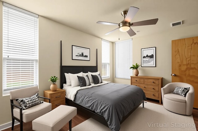 5309 Sendero Hills Pkwy, Austin, TX 78724 - bedroom with multiple windows, wood finished floors, and a ceiling fan