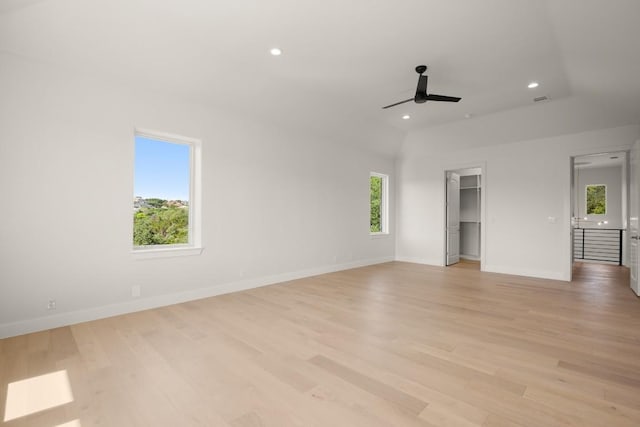 unfurnished room featuring ceiling fan, light wood-style floors, recessed lighting, and baseboards
