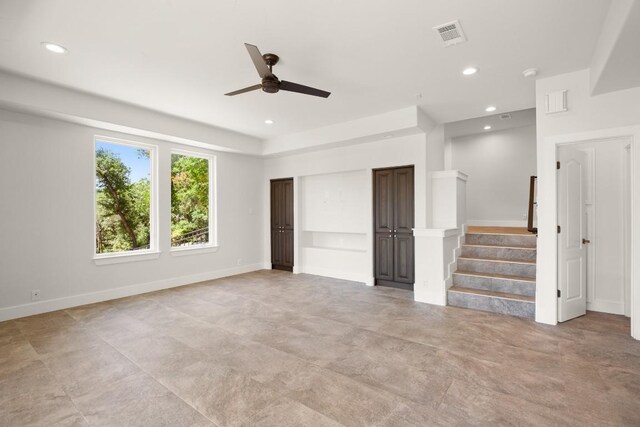 3401 Day Star Cv, Austin, TX 78746 - unfurnished living room with a ceiling fan, recessed lighting, and stairway