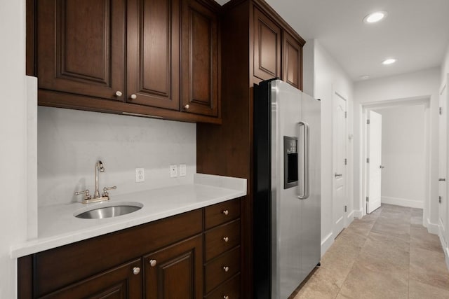 3401 Day Star Cv, Austin, TX 78746 - kitchen with stainless steel refrigerator with ice dispenser, light countertops, recessed lighting, and dark brown cabinetry