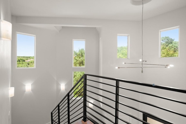 3401 Day Star Cv, Austin, TX 78746 - empty room featuring healthy amount of natural light, ceiling fan, baseboards, a raised ceiling, and recessed lighting