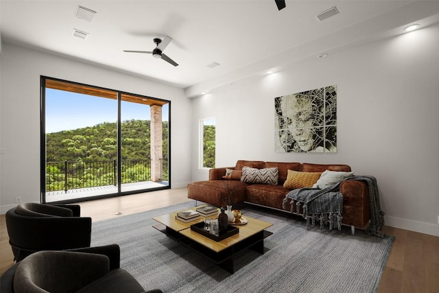 3401 Day Star Cv, Austin, TX 78746 - living room with a ceiling fan, wood finished floors, and recessed lighting
