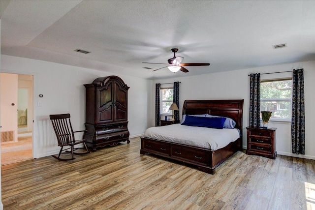 6022 Abilene Trl, Austin, TX 78749 - bedroom with light wood-style flooring and a ceiling fan
