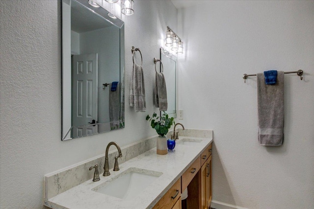6022 Abilene Trl, Austin, TX 78749 - full bath with double vanity and a textured wall