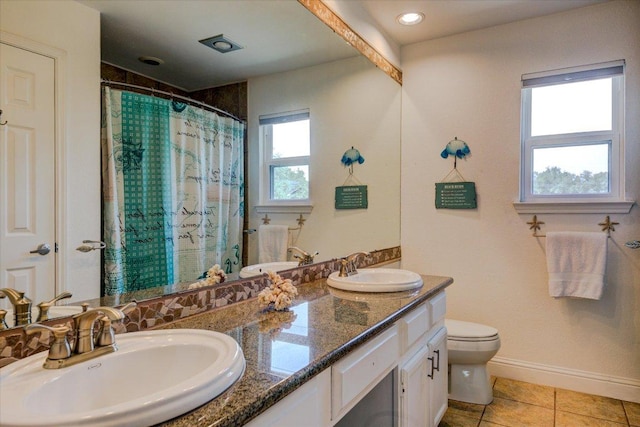 6022 Abilene Trl, Austin, TX 78749 - full bath featuring double vanity, tile patterned flooring, and a shower with shower curtain