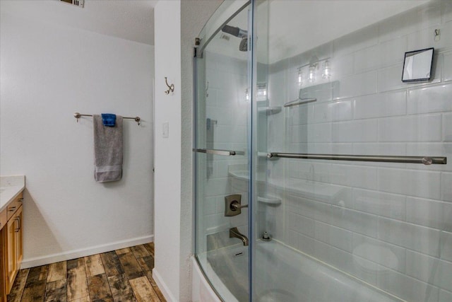 6022 Abilene Trl, Austin, TX 78749 - full bathroom with wood finished floors, vanity, and combined bath / shower with glass door