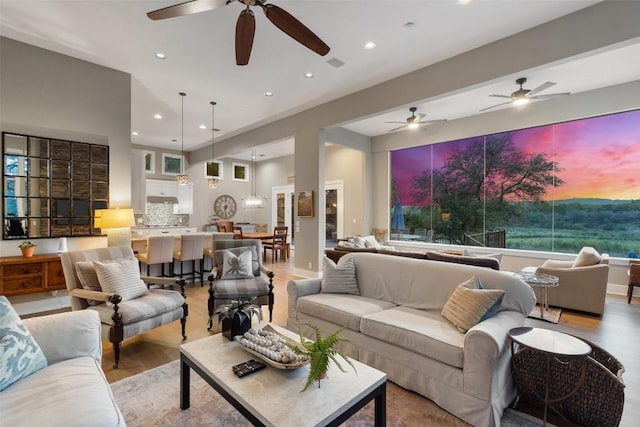 1348 Lake Shore Dr, Spicewood, TX 78669 - living room featuring ceiling fan, light wood-style floors, recessed lighting, and healthy amount of natural light