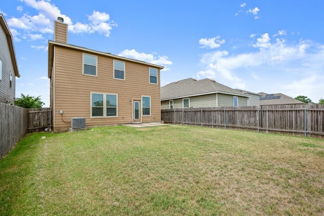 11325 Kirkland Hill Path, Austin, TX 78754 - back of property with a chimney, central AC unit, and a patio area