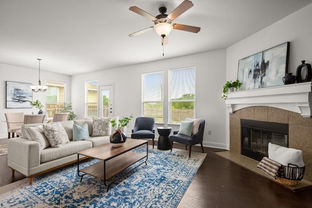 11325 Kirkland Hill Path, Austin, TX 78754 - living area with wood finished floors, ceiling fan, baseboards, and a chandelier
