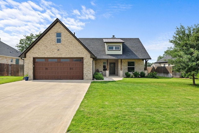 121 Gloria Blvd, Smithville, TX 78957 - view of front of property with driveway, brick siding, a shingled roof, and an attached garage