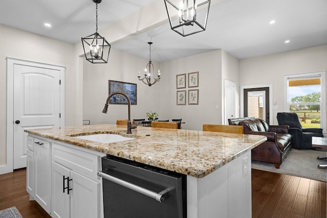 121 Gloria Blvd, Smithville, TX 78957 - kitchen with a sink, stainless steel dishwasher, a chandelier, a kitchen island with sink, and white cabinets