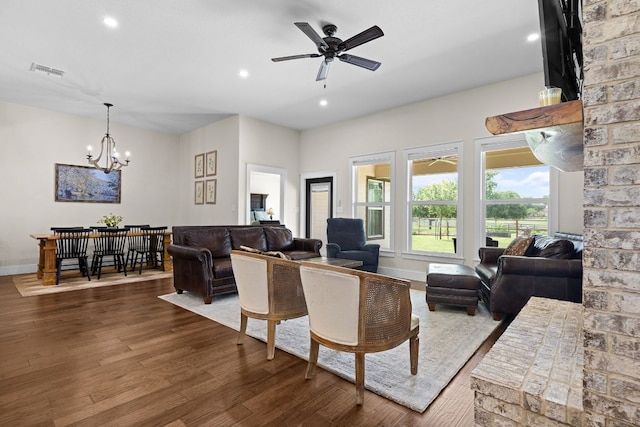 121 Gloria Blvd, Smithville, TX 78957 - living room featuring dark wood finished floors, a chandelier, a ceiling fan, recessed lighting, and baseboards