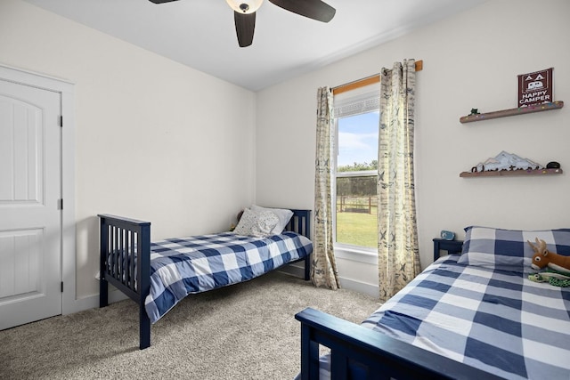 121 Gloria Blvd, Smithville, TX 78957 - bedroom featuring multiple windows, carpet flooring, and a ceiling fan