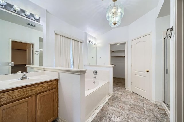 4712 Ramies Run, Austin, TX 78749 - bathroom with a bath, vanity, and marble look tile flooring