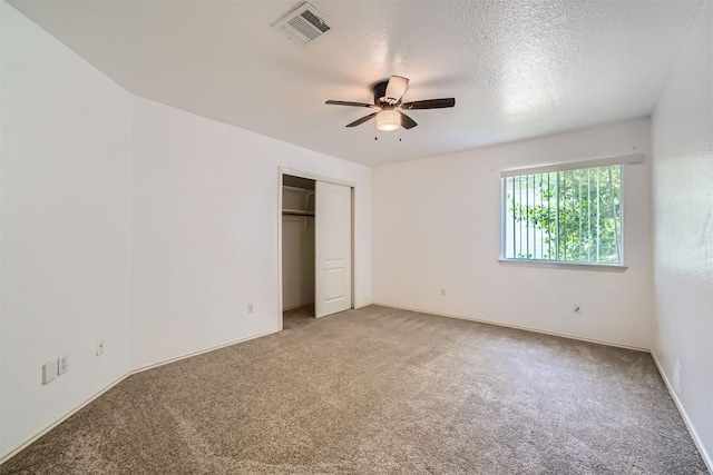 4712 Ramies Run, Austin, TX 78749 - unfurnished bedroom featuring light colored carpet, a closet, and ceiling fan