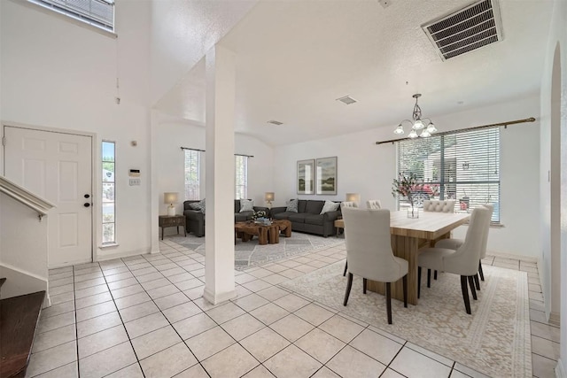4712 Ramies Run, Austin, TX 78749 - dining space with light tile patterned floors and a chandelier