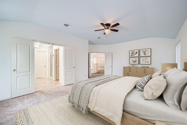 4712 Ramies Run, Austin, TX 78749 - carpeted bedroom with lofted ceiling, a ceiling fan, and connected bathroom