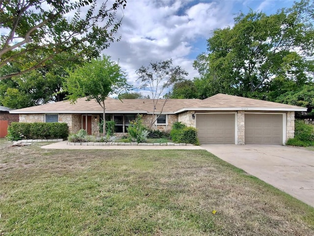 9512 Meadowheath Dr, Austin, TX 78729 - single story home with stone siding, an attached garage, driveway, and a front yard