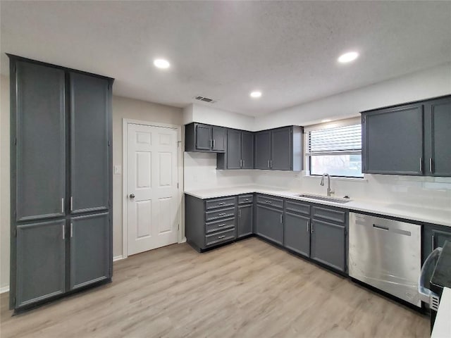 9512 Meadowheath Dr, Austin, TX 78729 - kitchen featuring dishwasher, a sink, light wood finished floors, recessed lighting, and light countertops