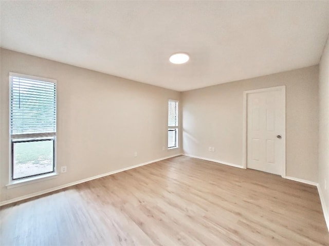 9512 Meadowheath Dr, Austin, TX 78729 - unfurnished room with light wood-type flooring and baseboards