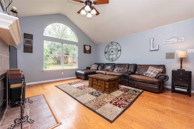 1006 Savanna Ln, Cedar Park, TX 78613 - living room with a ceiling fan, lofted ceiling, wood finished floors, and baseboards