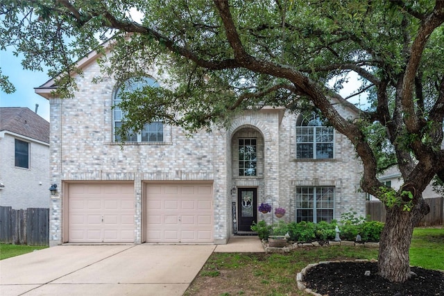 1006 Savanna Ln, Cedar Park, TX 78613 - traditional-style house with driveway, an attached garage, and brick siding