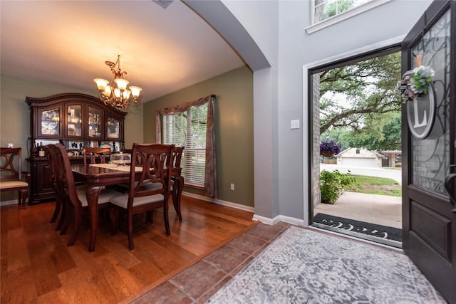 1006 Savanna Ln, Cedar Park, TX 78613 - entryway with arched walkways, a chandelier, healthy amount of natural light, and dark wood-style flooring