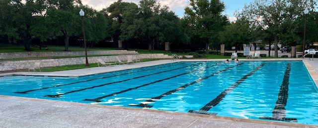 1006 Savanna Ln, Cedar Park, TX 78613 - community pool with view of scattered trees and a patio