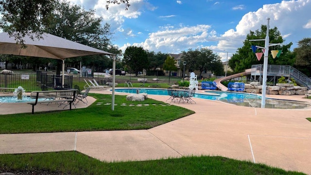 1006 Savanna Ln, Cedar Park, TX 78613 - community pool with a water slide, stairway, and a patio area