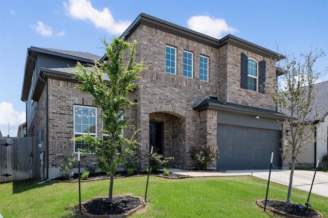 707 Sugar Cane Rd, Buda, TX 78610 - view of front of home with concrete driveway, brick siding, and an attached garage