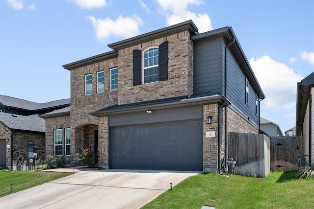 707 Sugar Cane Rd, Buda, TX 78610 - view of front of house featuring an attached garage, concrete driveway, and brick siding