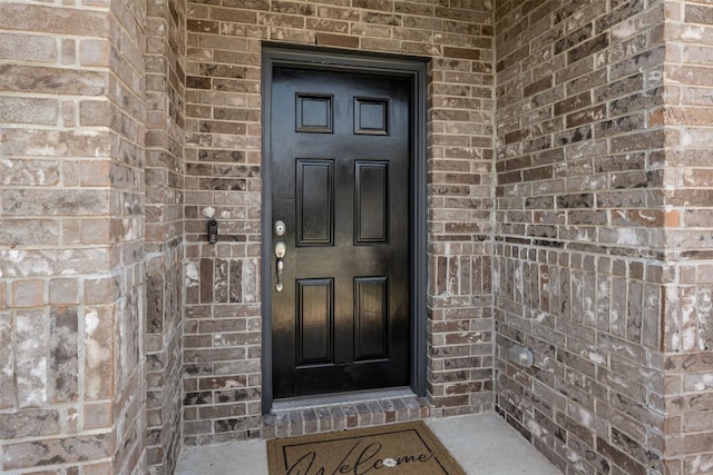 707 Sugar Cane Rd, Buda, TX 78610 - doorway to property featuring brick siding