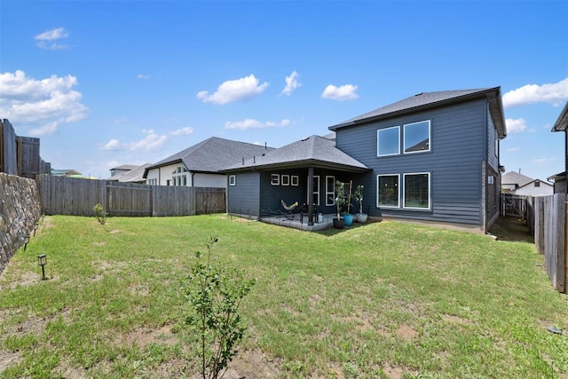 707 Sugar Cane Rd, Buda, TX 78610 - back of property with a patio