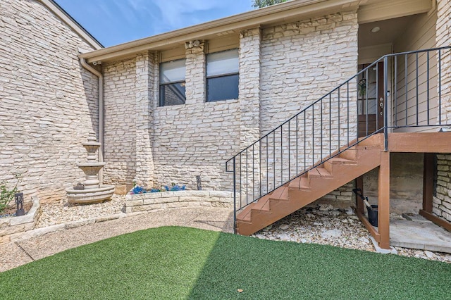 9518 Topridge Dr Unit 7, Austin, TX 78750 - view of home's exterior featuring stone siding