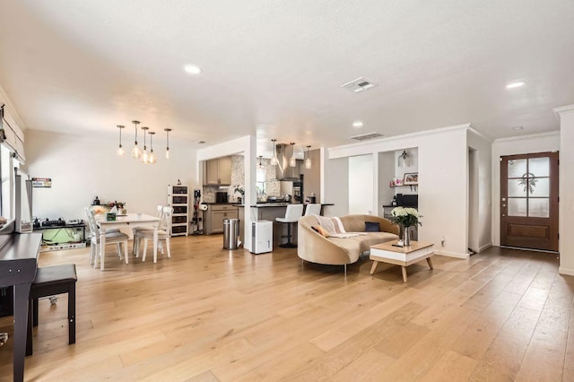 9518 Topridge Dr Unit 7, Austin, TX 78750 - living area with crown molding, recessed lighting, and light wood-style flooring