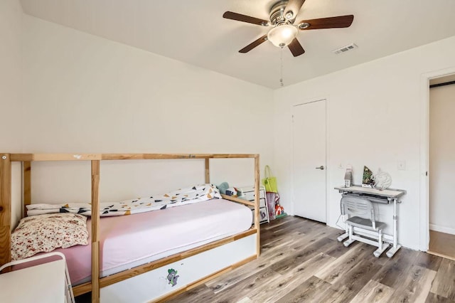 9518 Topridge Dr Unit 7, Austin, TX 78750 - bedroom with wood finished floors and a ceiling fan