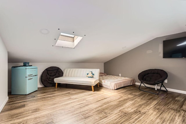 9518 Topridge Dr Unit 7, Austin, TX 78750 - sitting room featuring a skylight, light wood-style floors, and vaulted ceiling