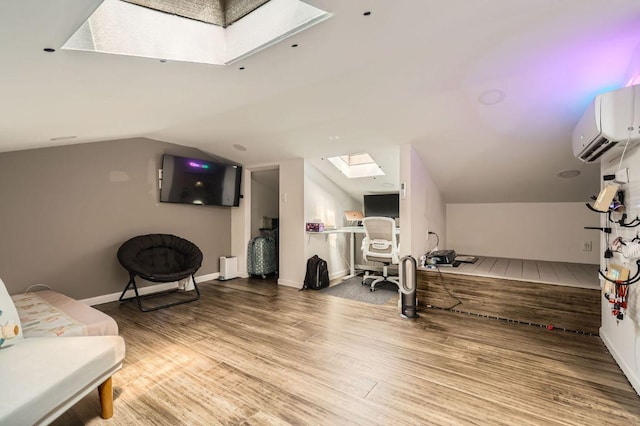 9518 Topridge Dr Unit 7, Austin, TX 78750 - workout room with a skylight, a wall mounted air conditioner, wood finished floors, and vaulted ceiling