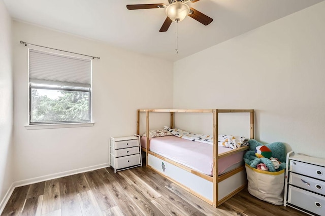 9518 Topridge Dr Unit 7, Austin, TX 78750 - bedroom with wood finished floors and a ceiling fan