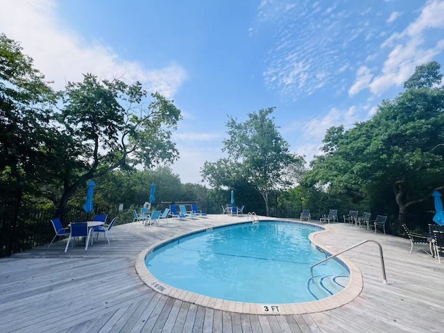 9518 Topridge Dr Unit 7, Austin, TX 78750 - community pool with a wooden deck and view of scattered trees