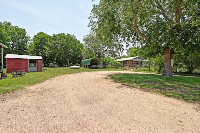 10908 Slaughter Creek Dr, Austin, TX 78748 - view of dirt / gravel driveway featuring view of scattered trees