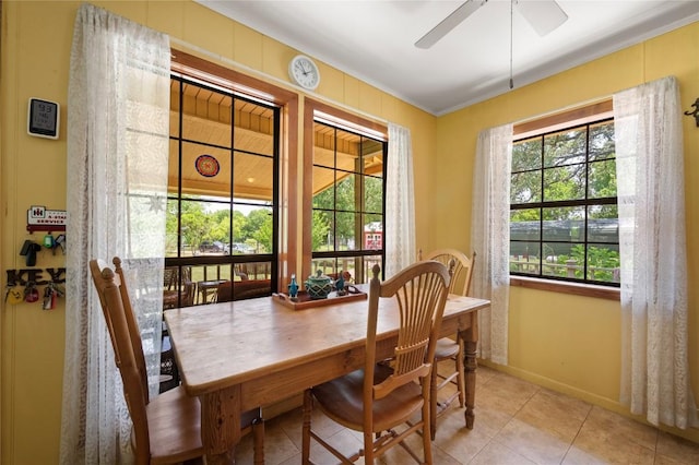 10908 Slaughter Creek Dr, Austin, TX 78748 - dining room with a ceiling fan, light tile patterned floors, and ornamental molding