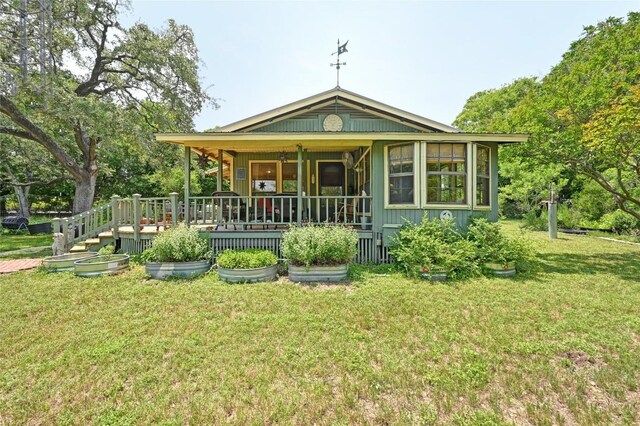 10908 Slaughter Creek Dr, Austin, TX 78748 - rear view of house with a lawn