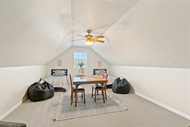 1409 Old Mill Rd, Salado, TX 76571 - bedroom with a textured ceiling, lofted ceiling, baseboards, carpet floors, and ceiling fan