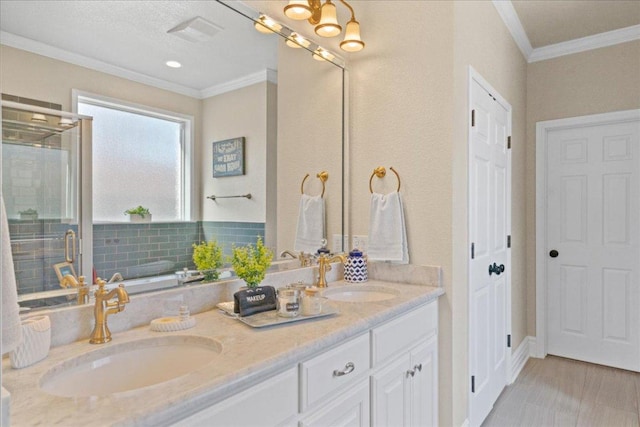 1409 Old Mill Rd, Salado, TX 76571 - full bathroom with crown molding, double vanity, a shower stall, and a tub
