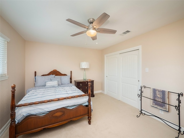 2702 Double Tree St, Round Rock, TX 78681 - bedroom with a closet, light carpet, a ceiling fan, and baseboards