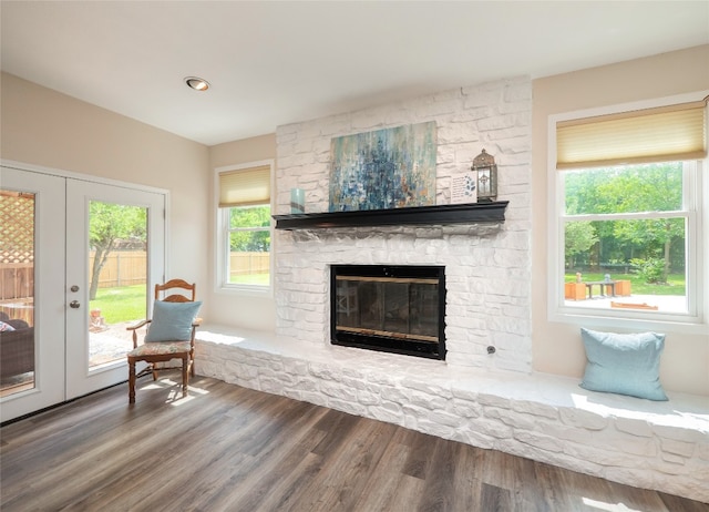 2702 Double Tree St, Round Rock, TX 78681 - living room featuring a fireplace, wood finished floors, and french doors
