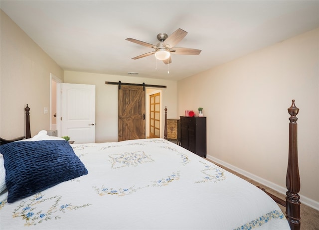 2702 Double Tree St, Round Rock, TX 78681 - carpeted bedroom with a barn door, baseboards, and a ceiling fan
