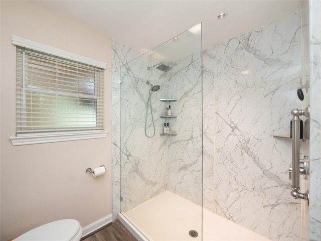 2702 Double Tree St, Round Rock, TX 78681 - bathroom featuring a marble finish shower, toilet, baseboards, and wood finished floors